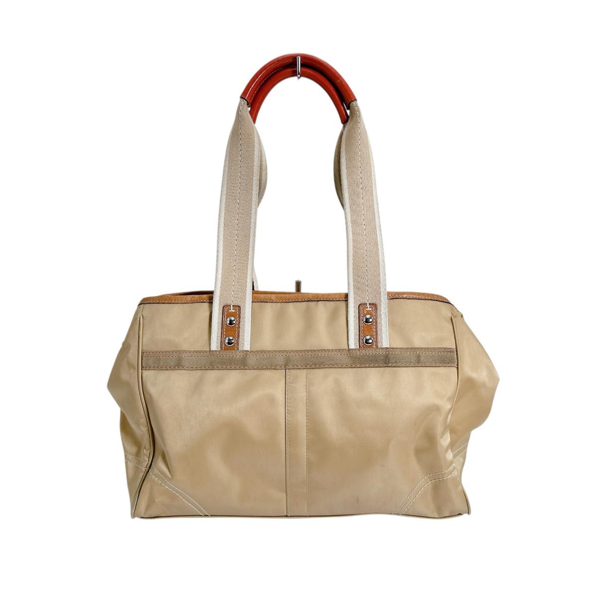 コーチ COACH ハンドバッグ
トートバッグ 無地 シグネチャー ナイロン MO682-10663 ゴールド 【SS】
【中古】