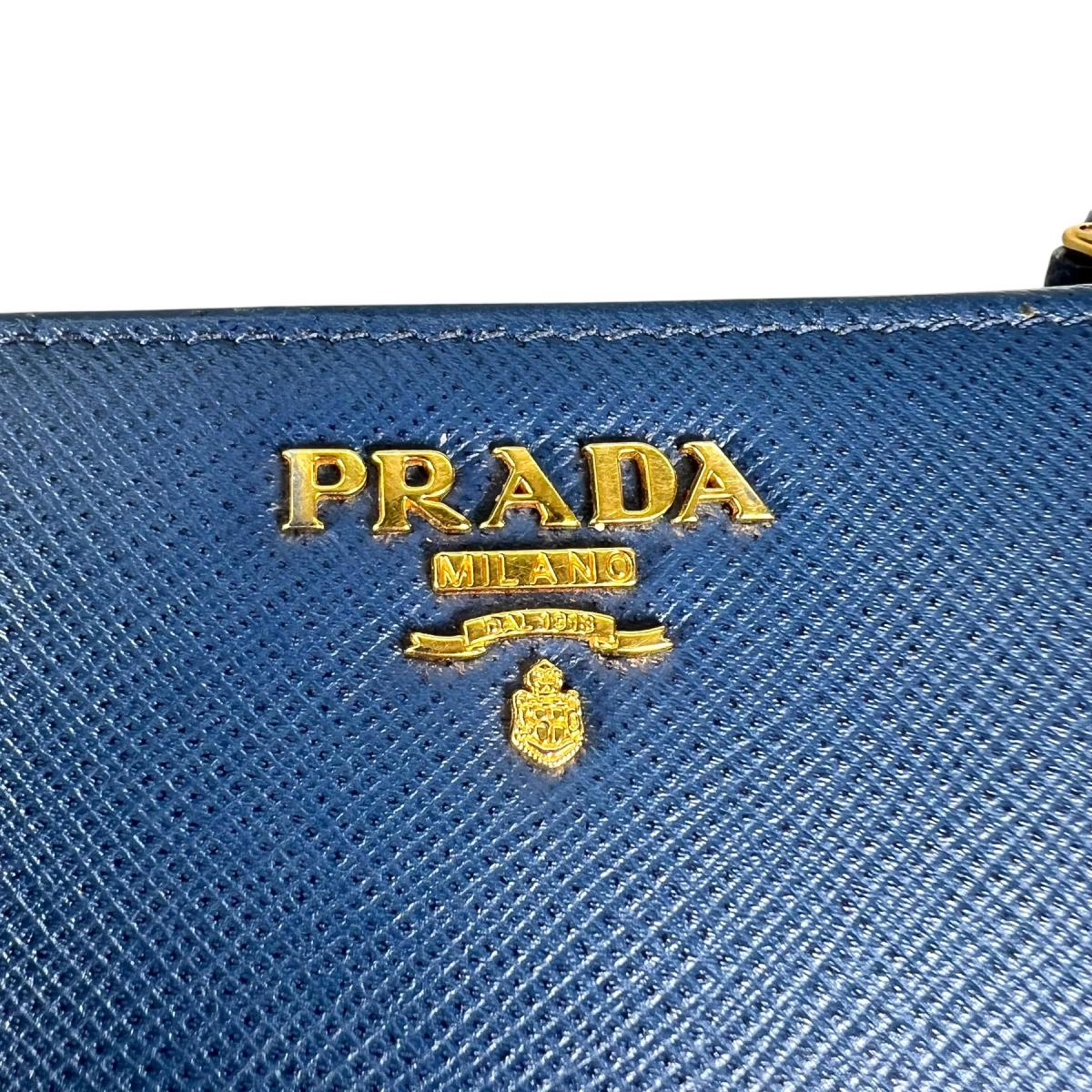 プラダ PRADA 二つ折り財布
 二つ折り財布 ジップアラウンド サフィアーノ レザー 1ML018 ブルー 【SS】
 【中古】