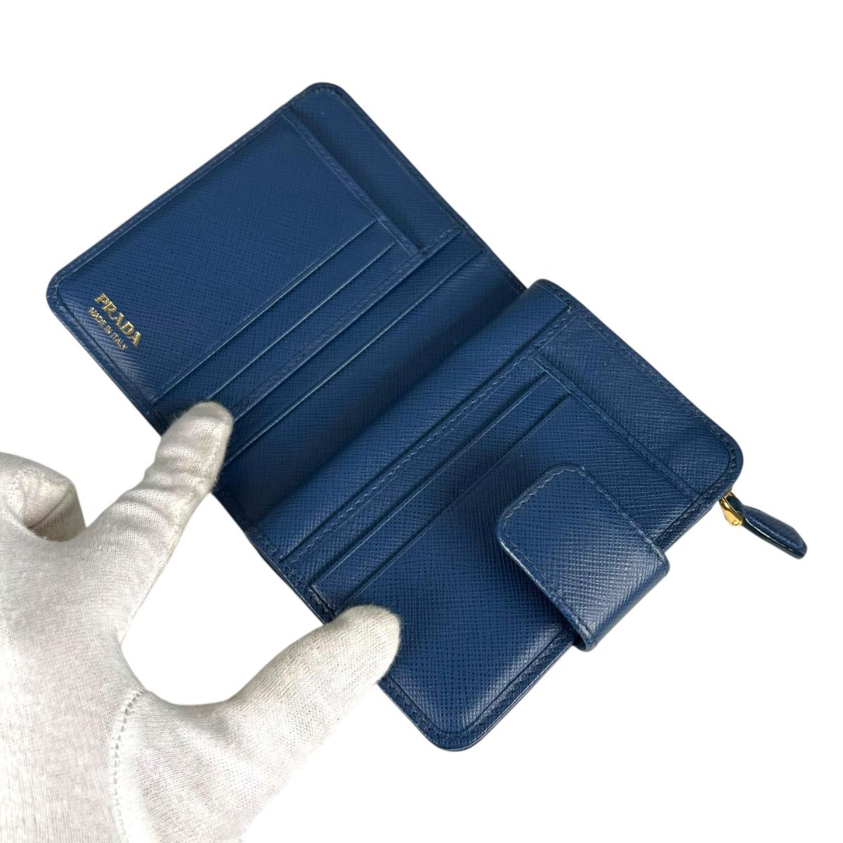 プラダ PRADA 二つ折り財布
 二つ折り財布 ジップアラウンド サフィアーノ レザー 1ML018 ブルー 【SS】
 【中古】