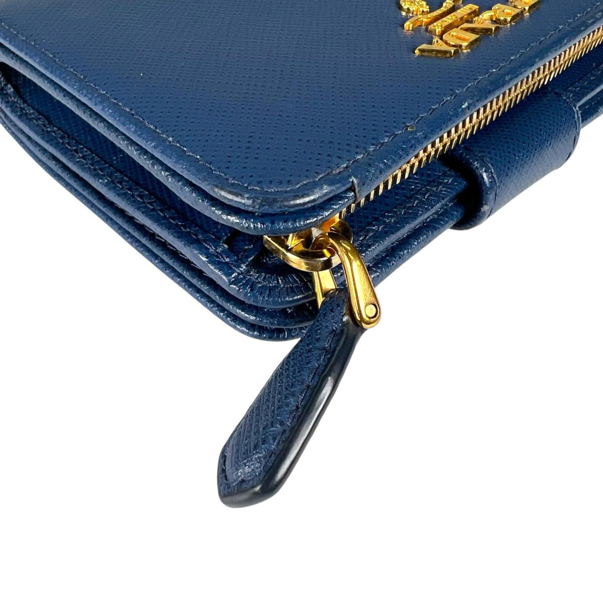 プラダ PRADA 二つ折り財布
 二つ折り財布 ジップアラウンド サフィアーノ レザー 1ML018 ブルー 【SS】
 【中古】