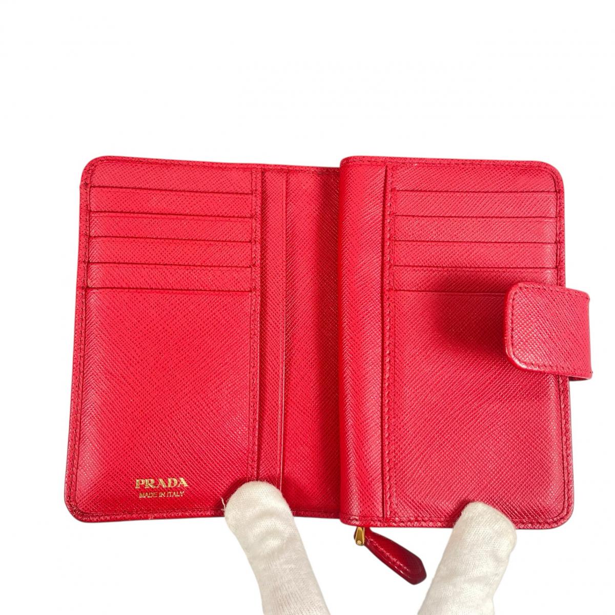 プラダ PRADA 二つ折り財布
 二つ折り財布 ジップアラウンド サフィアーノ レザー 1ML225 レッド 【SS】
 【中古】